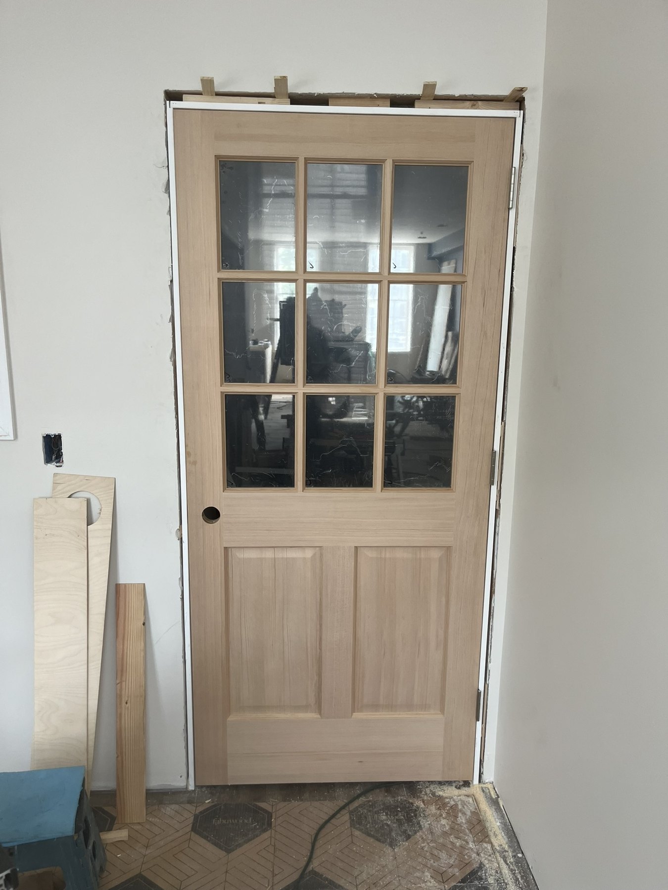 Glazed wood interior door during installation
