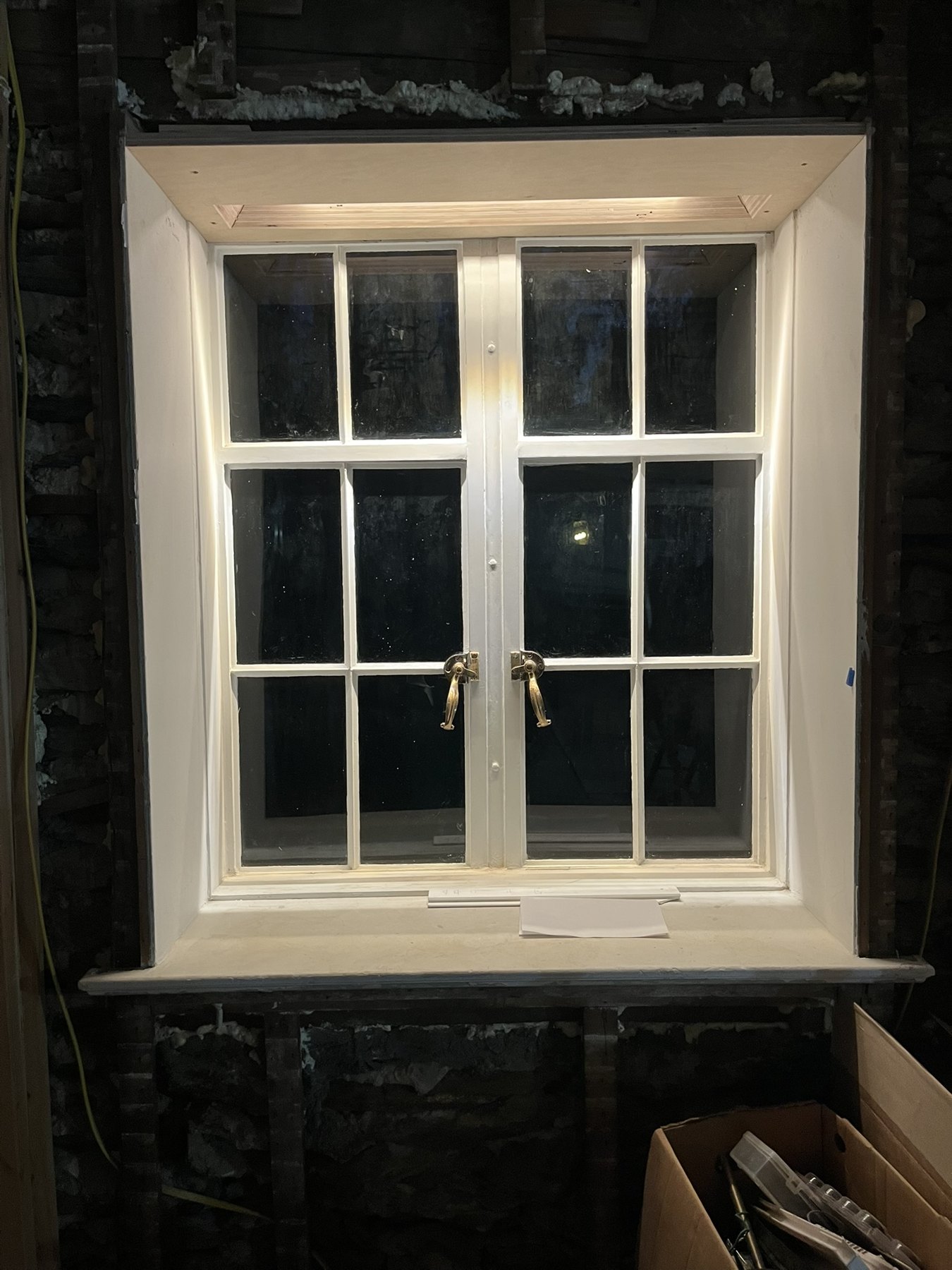 Recessed lighting washing an existing window