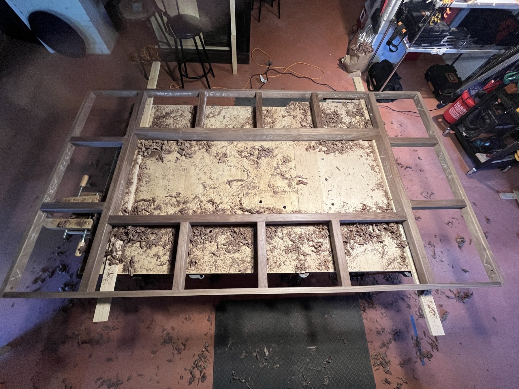 Walnut assembly on the workbench amid wood shavings