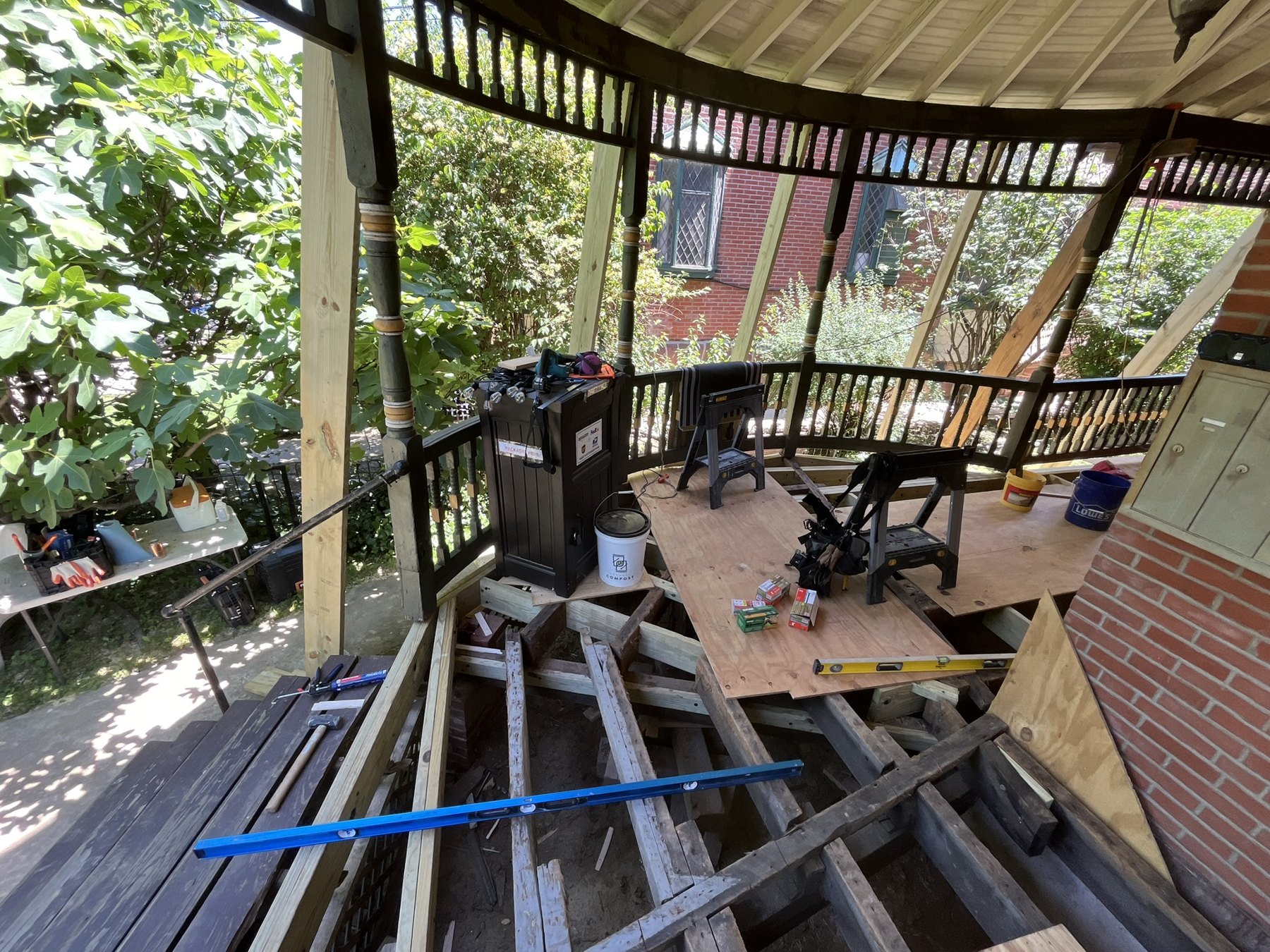 Exposed framing following the circular corner of the wraparound porch